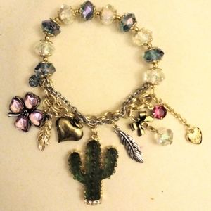 Pretty Betsey Johnson Desert Charm Braclet.